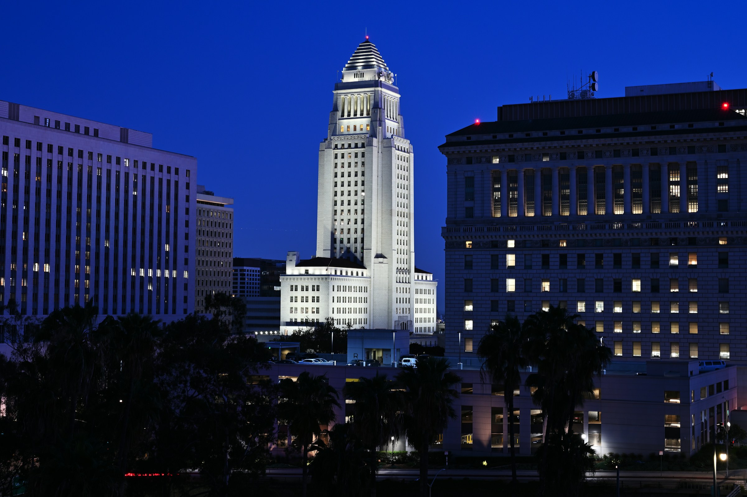 Los Angeles City Hall against a clear blue evening sky